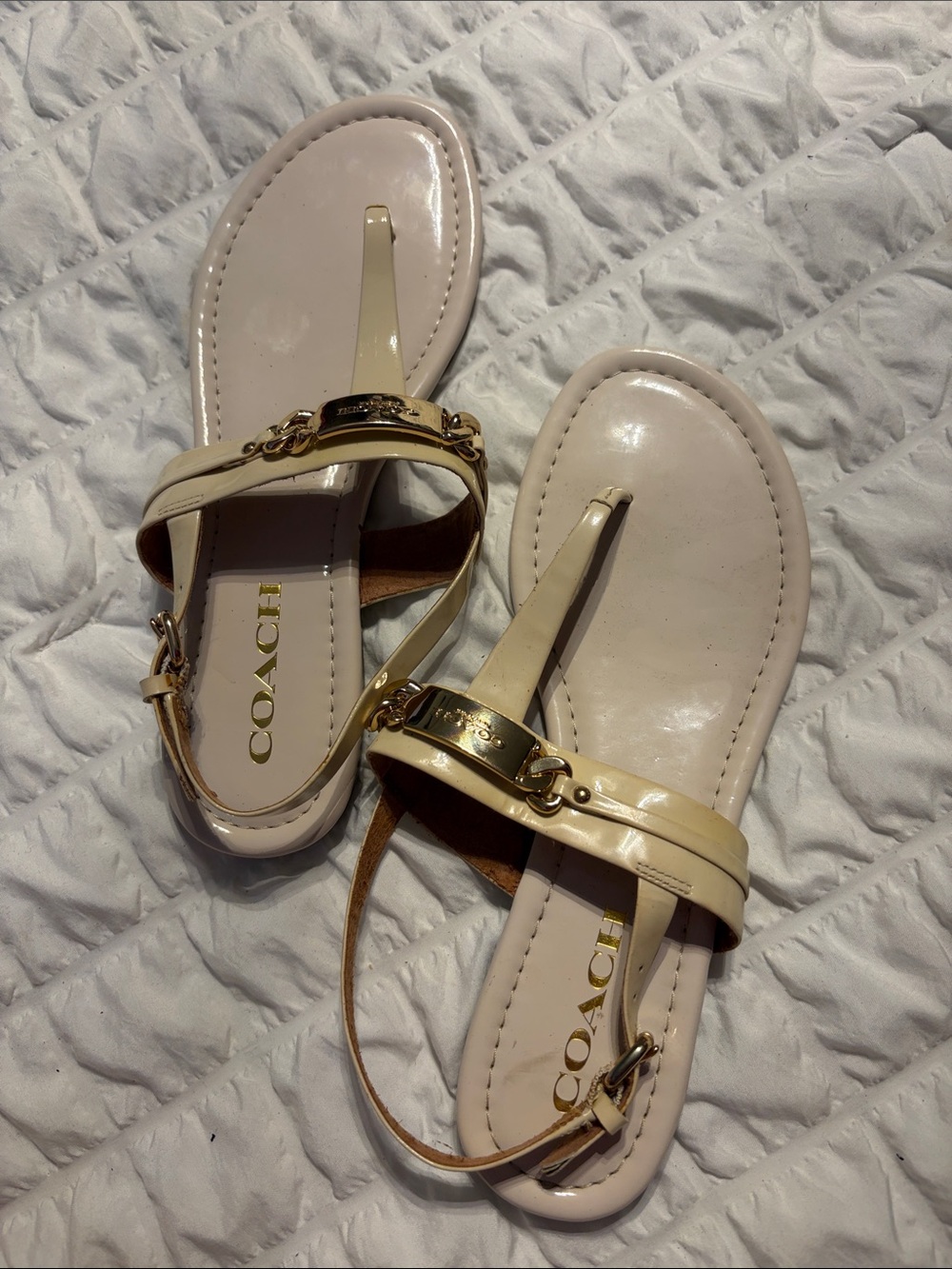 Coach Women's Cream Patent Leather T-Strap Sandals with Gold Hardware